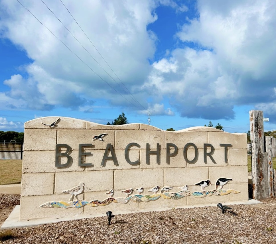 Beachport town entry sign built from limestone blocks with mosaic artwork